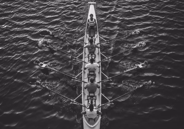 Men in a canoe, working together
